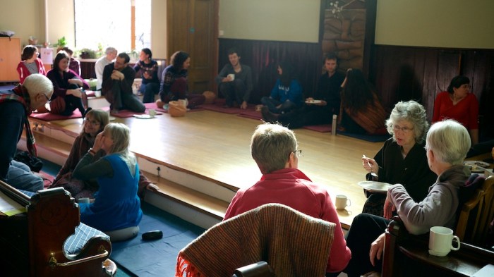 People sitting, smiling and talking